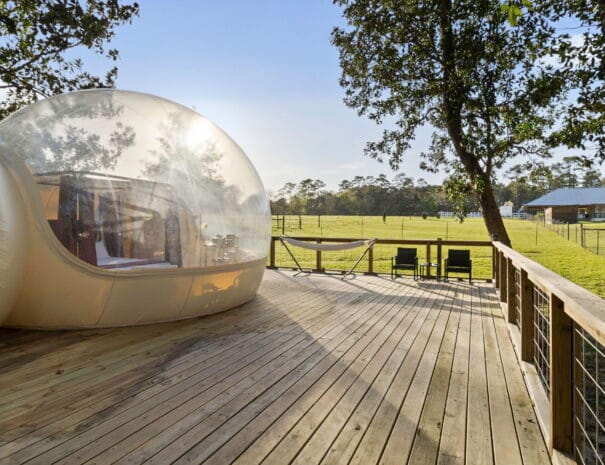 Unwind on your private deck overlooking the serene countryside, complete with a hammock, lounge chairs, and open sky. Perfect for sipping morning coffee or watching the stars.